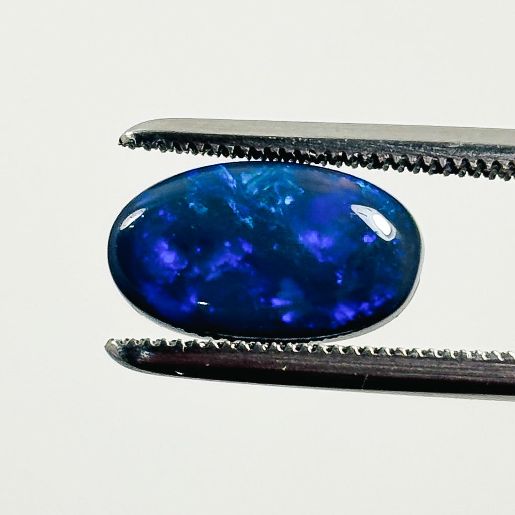 Black Opal Blue 11x7x3 Cabochon Oval 1.80 Carat