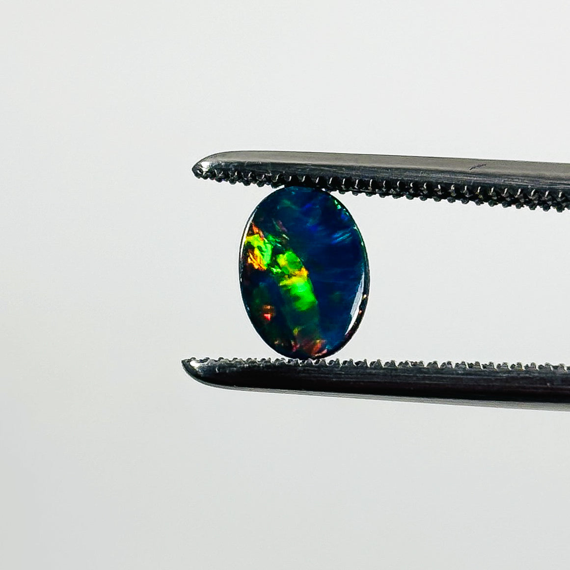 Doublet Opal Multicolour 7x5x2 Cabochon Oval 0.65 Carat