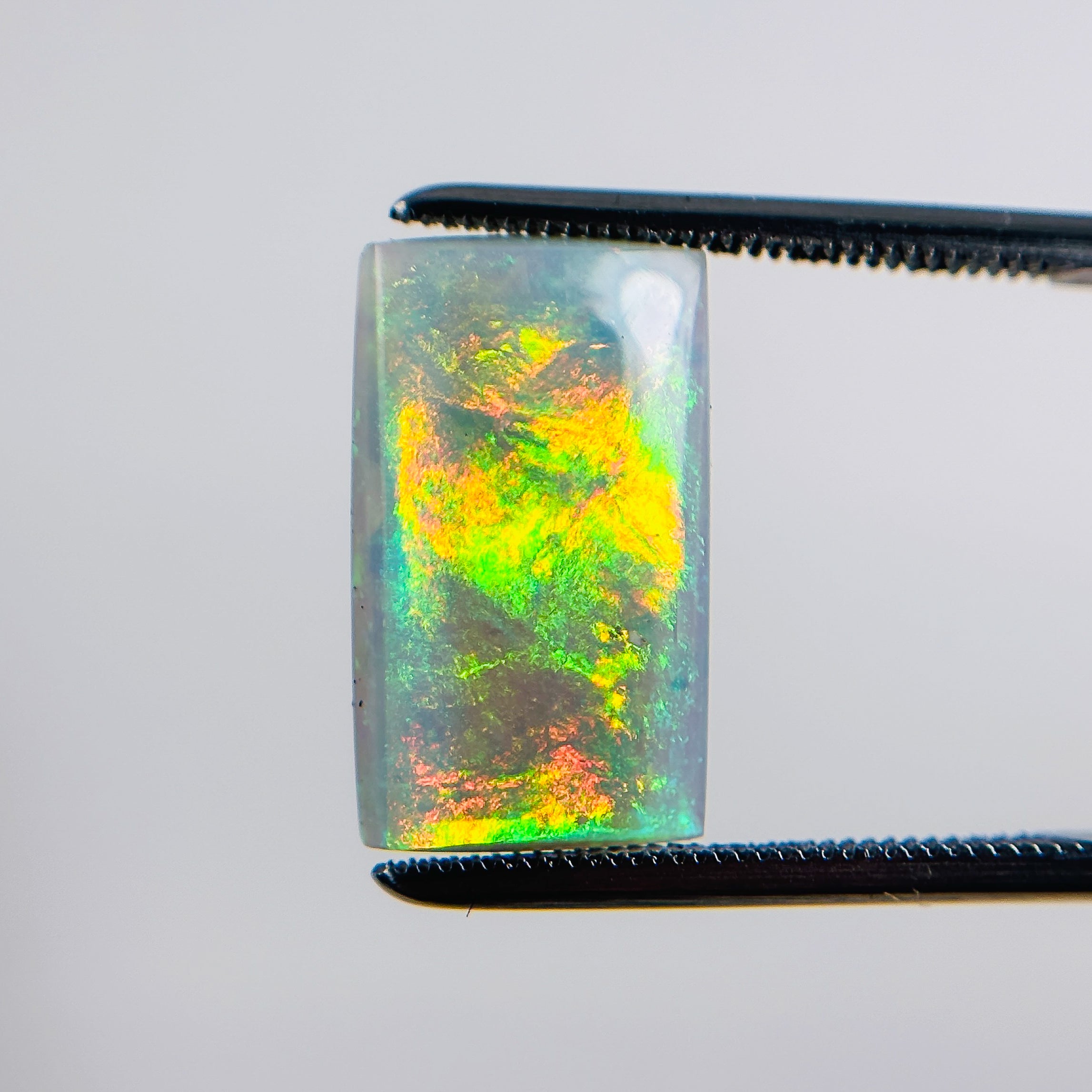 Semi Black Opal Orange Green 16x10x4 Cabochon Rectangle 5.10 Carat