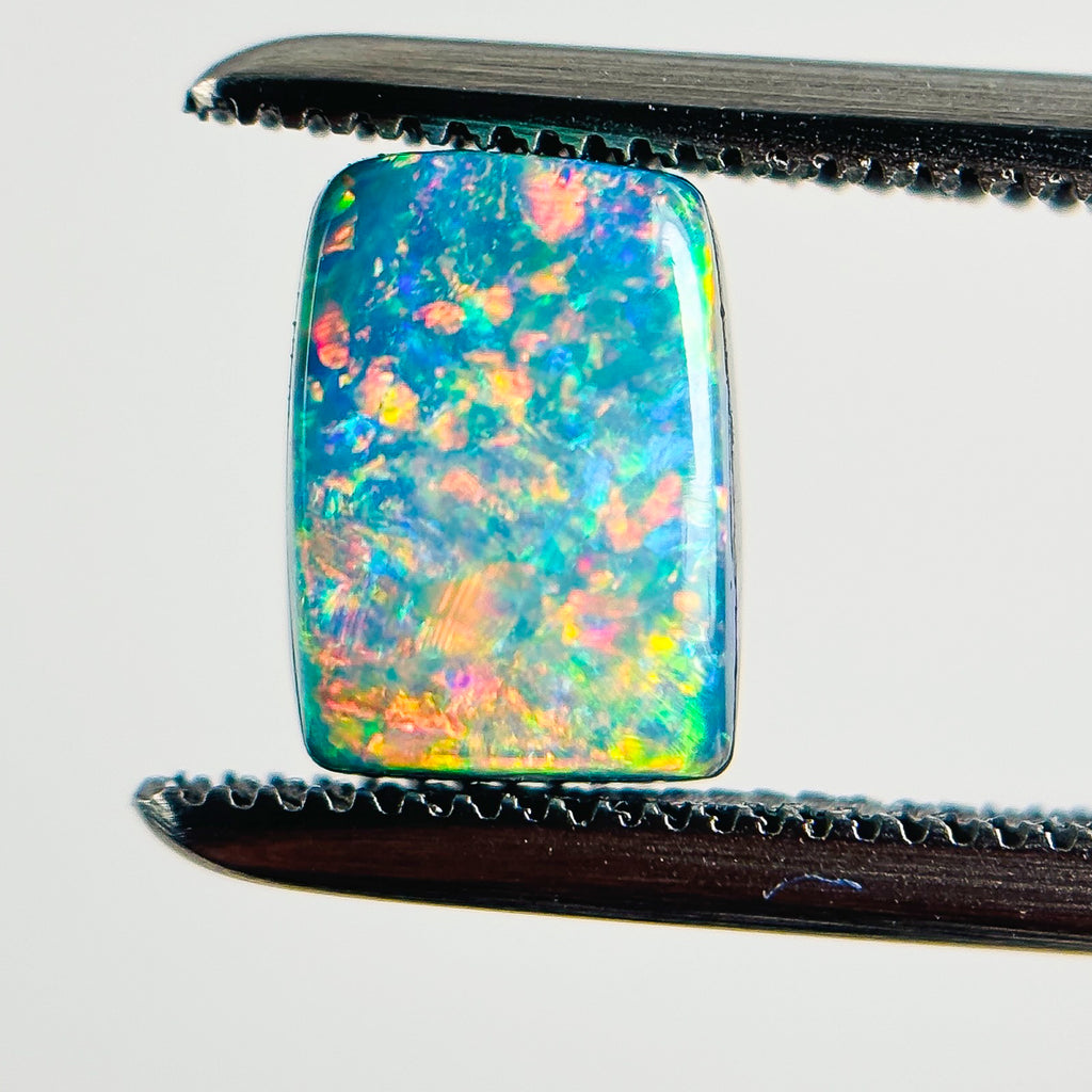 Doublet Opal Red Multi 7X5X4 Cabochon Rectangle 1.25 Carat