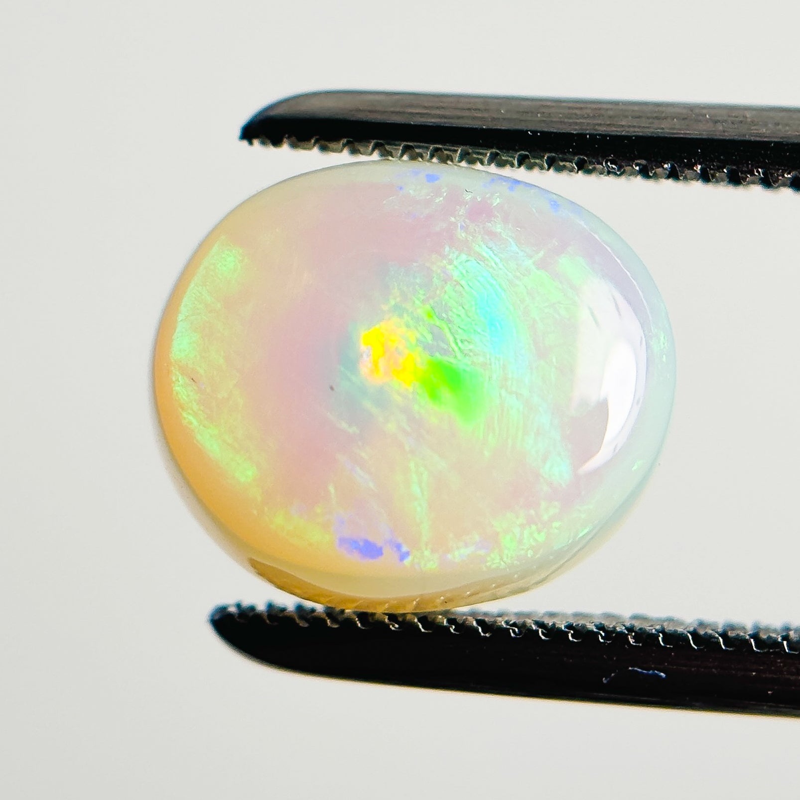 White Opal Green Orange 10x9x4 Cabochon Oval 2.60 Carat