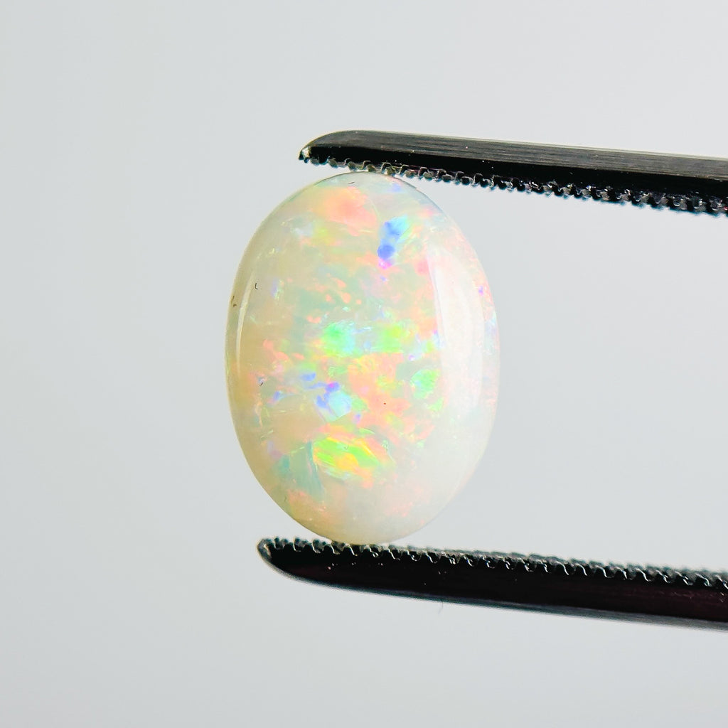 White Opal Multicolour 11x8x3 Cabochon Oval 1.40 Carat