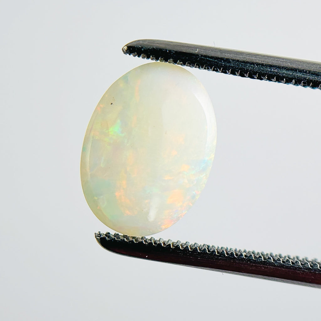 White Opal Multicolour 11x8x3 Cabochon Oval 1.40 Carat