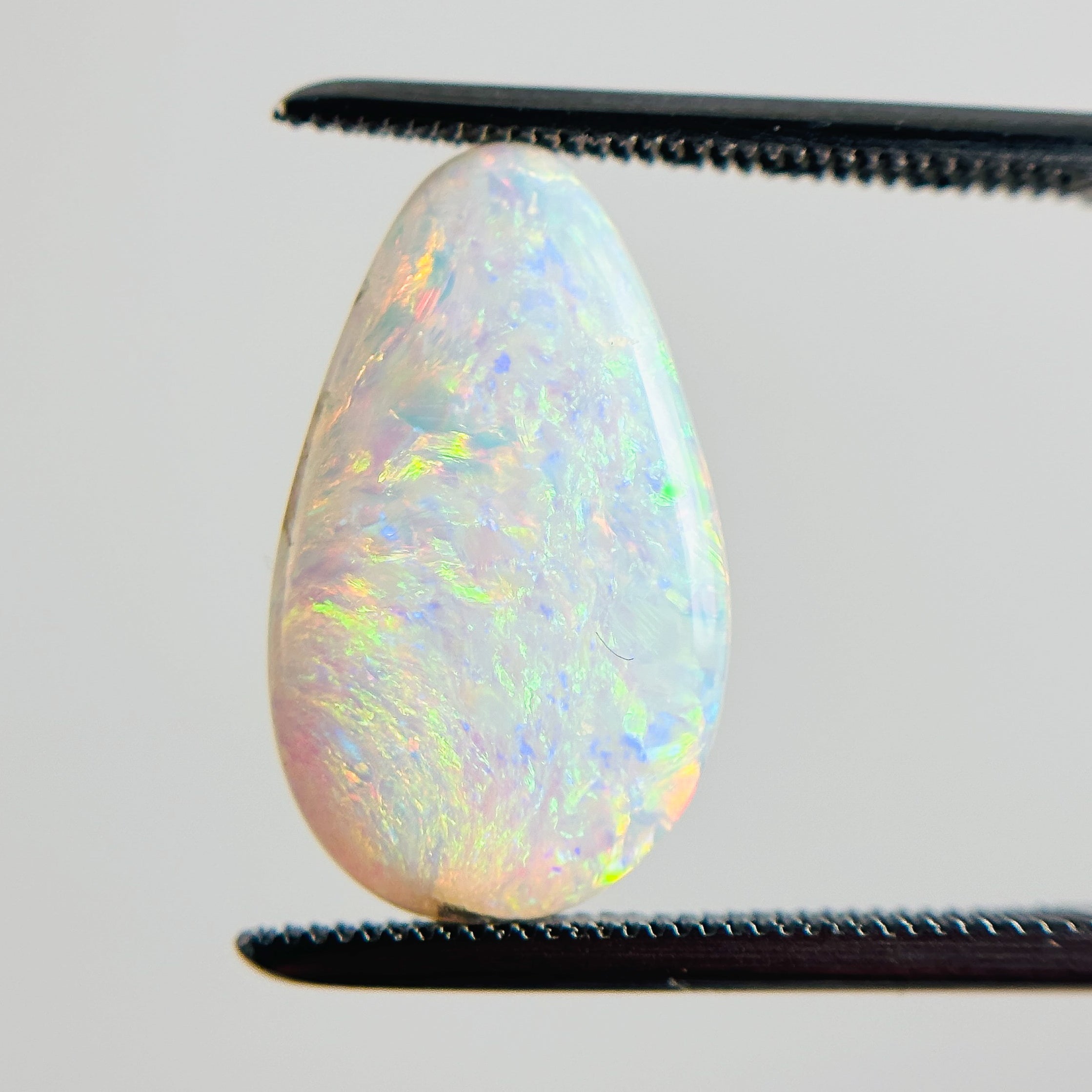 White Opal Multicolour 17x10x3 Cabochon Pear 2.95 Carat