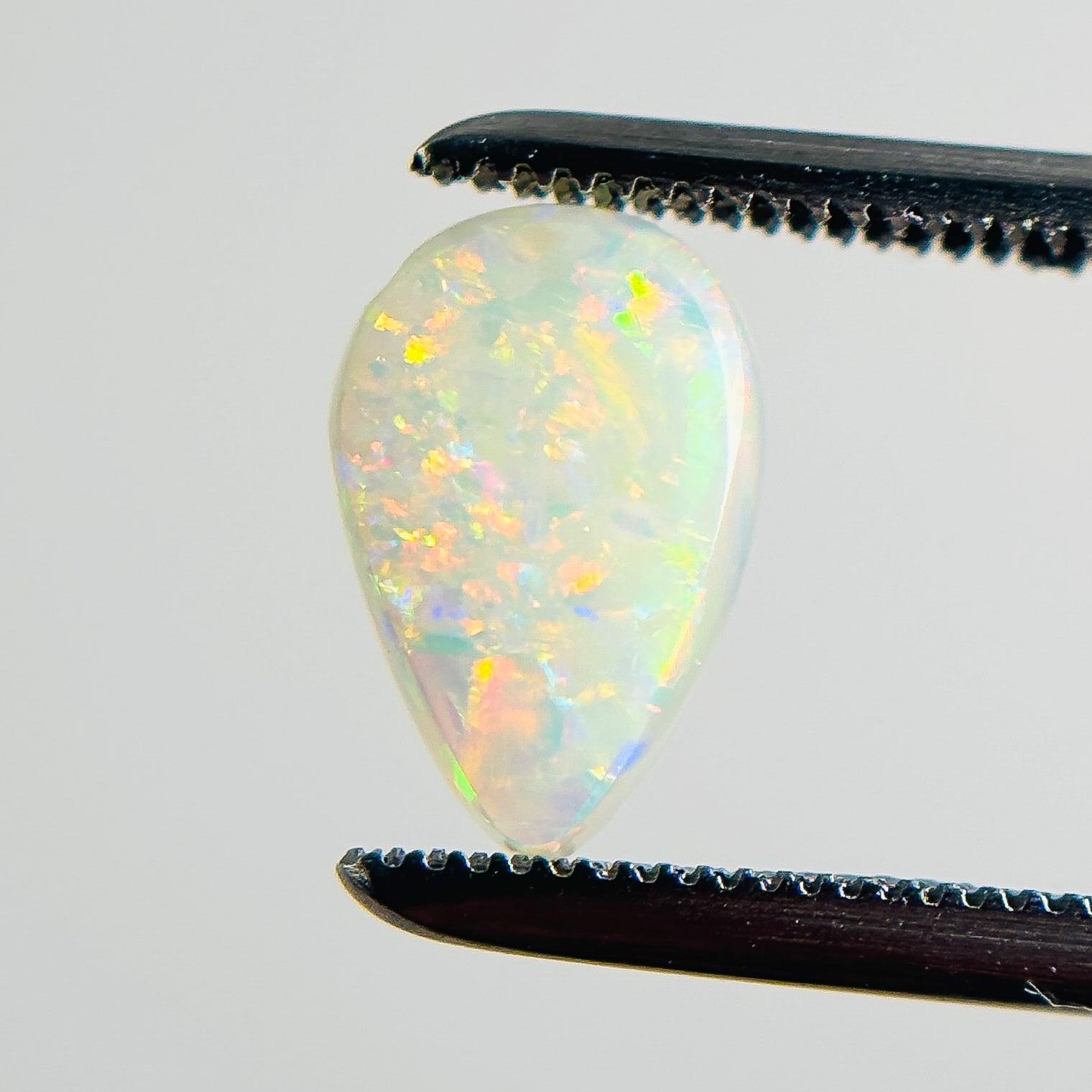 White Opal Multicolour 9x6x2 Cabochon Pear 0.80 Carat