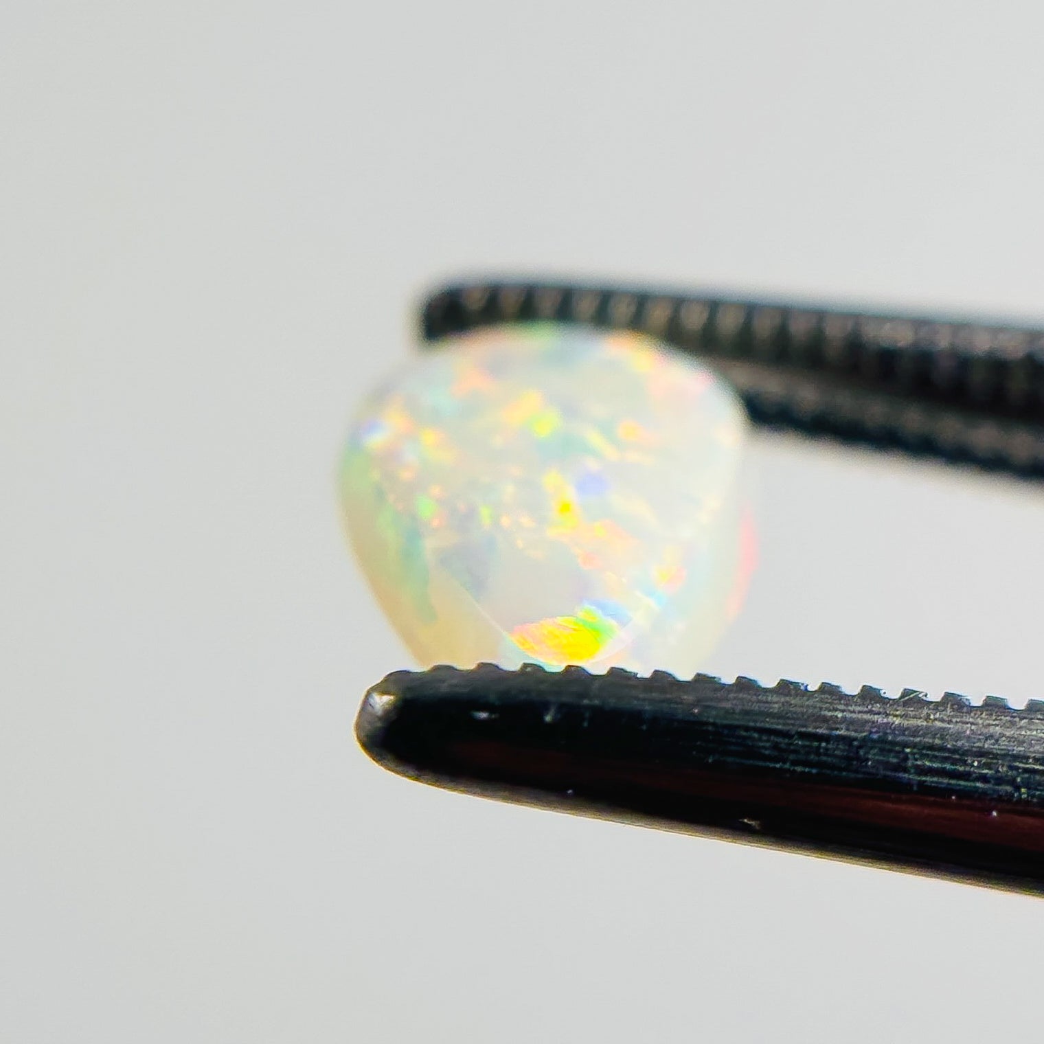 White Opal Multicolour 9x6x2 Cabochon Pear 0.80 Carat