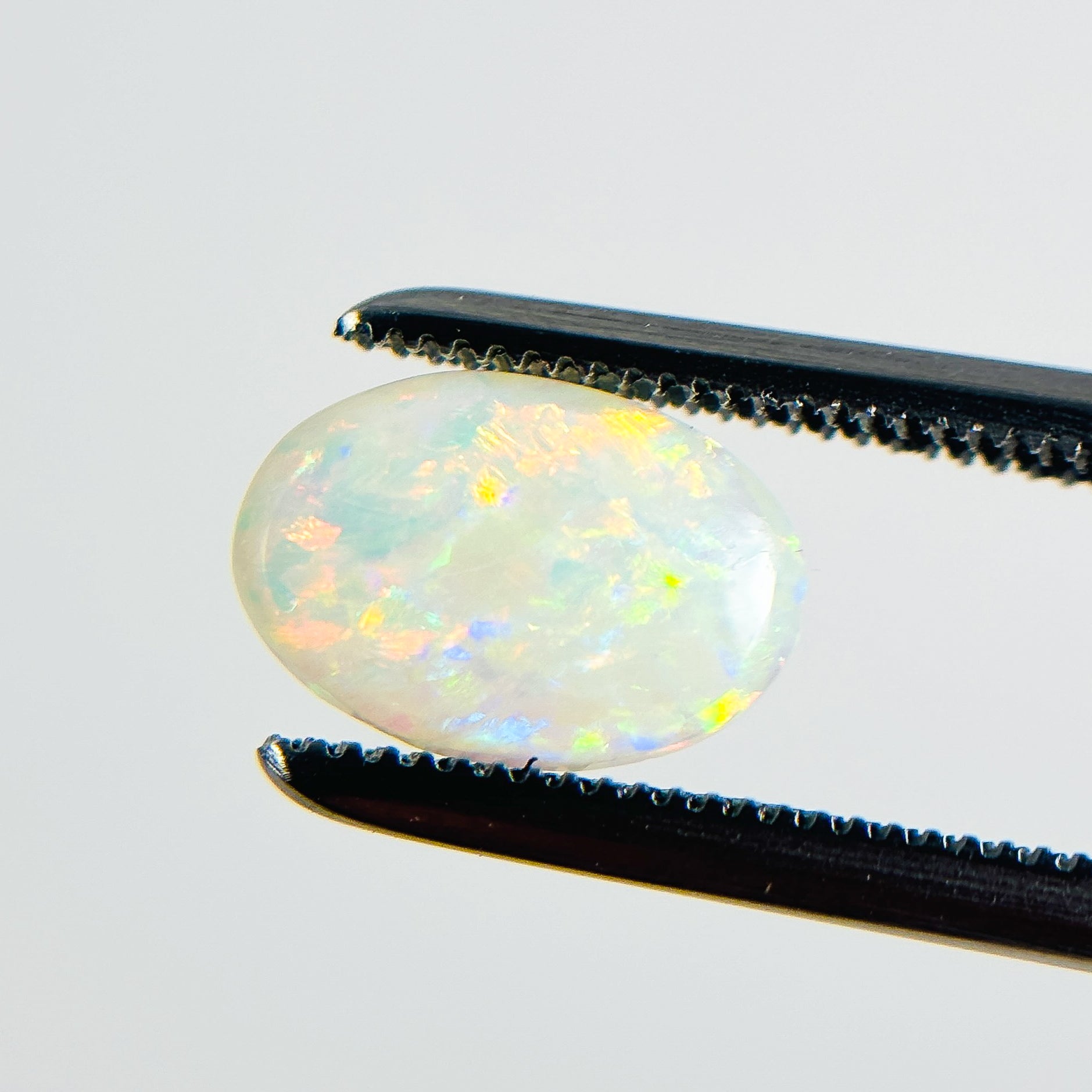 White Opal Multicolour 9x6x2 Cabochon Oval 0.80 Carat