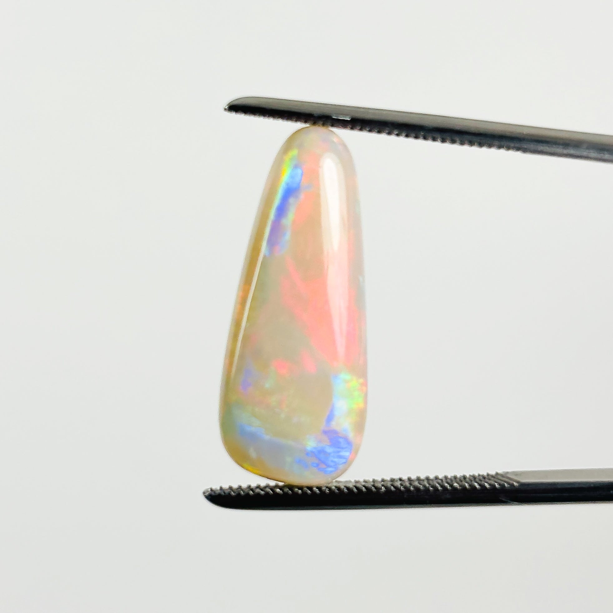 White Opal Red Multicolour 21x8.8x5 Cabochon Pear 5.85 Carat