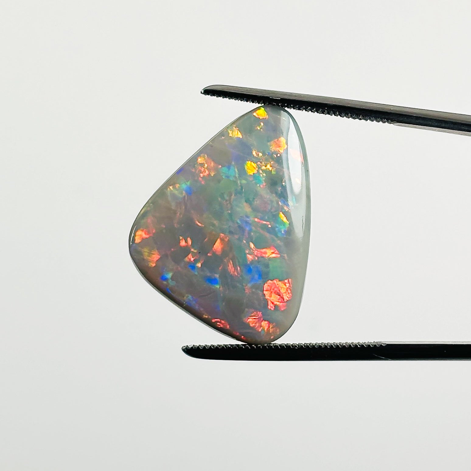 Semi Black Opal Red Multicolour 2x17x4.6 Cabochon Freeform 10.1 Carat