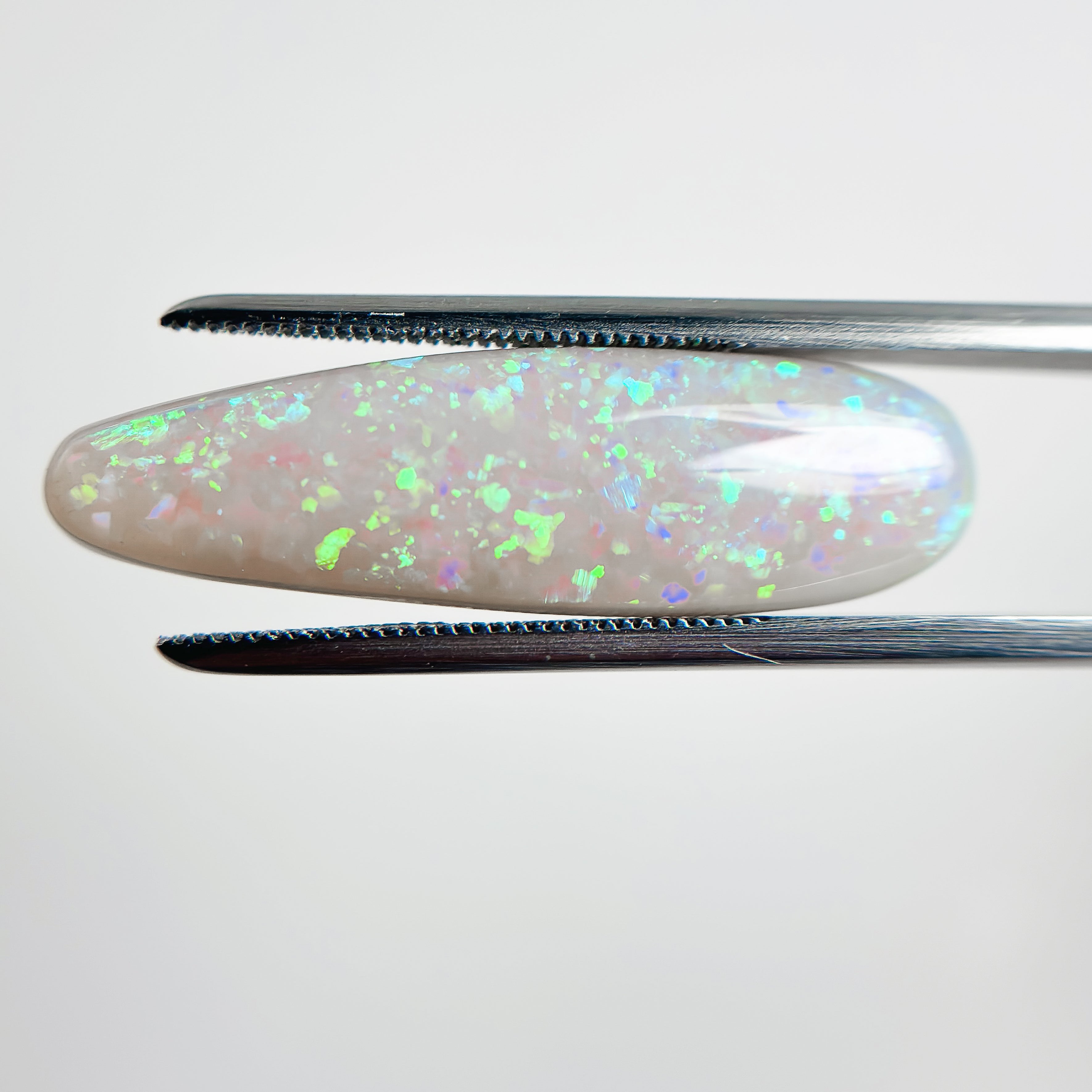 Semi Black Opal Green Blue 29x8.5x5 Cabochon Pear 8.50 Carat