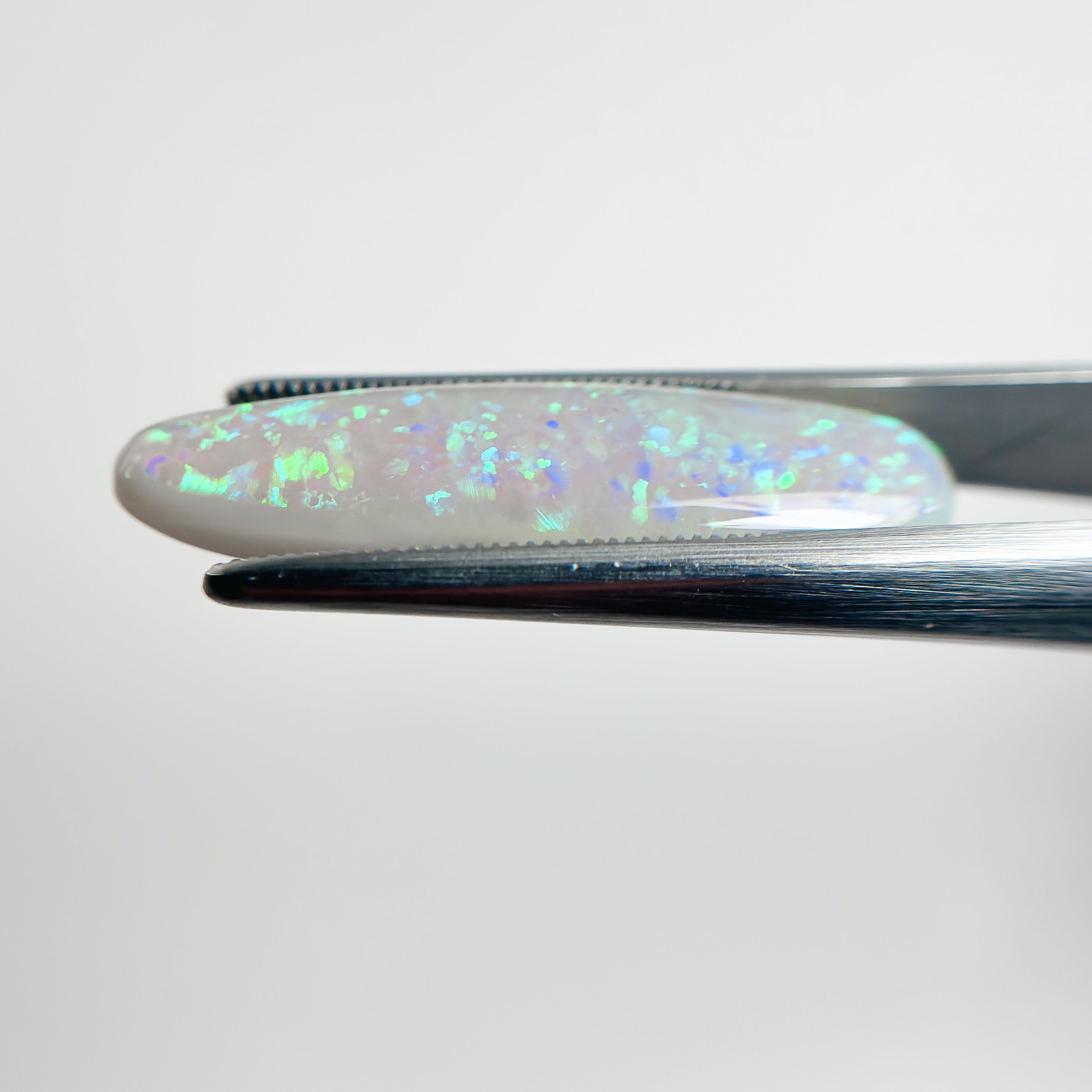 Semi Black Opal Green Blue 29x8.5x5 Cabochon Pear 8.50 Carat