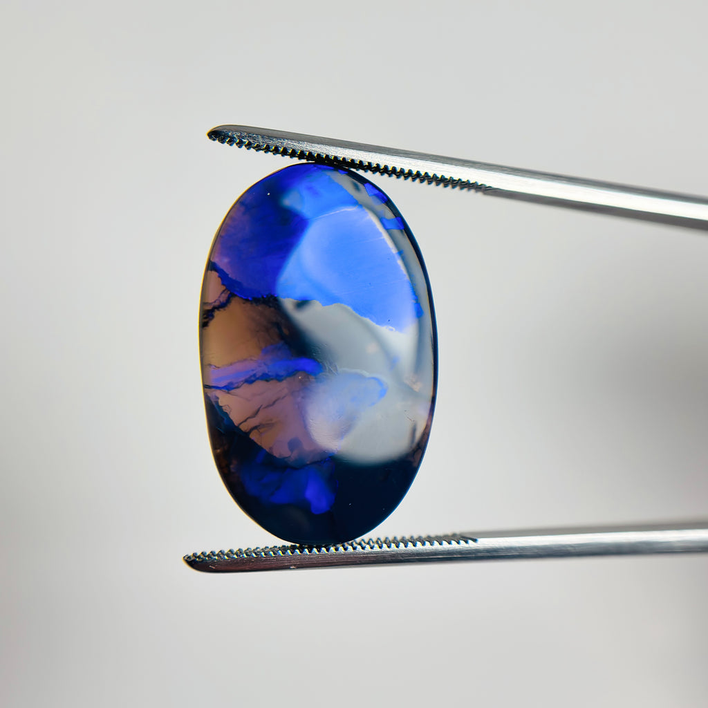 Black Opal Blue 24x16x3 Cabochon Oval 7.75 Carat