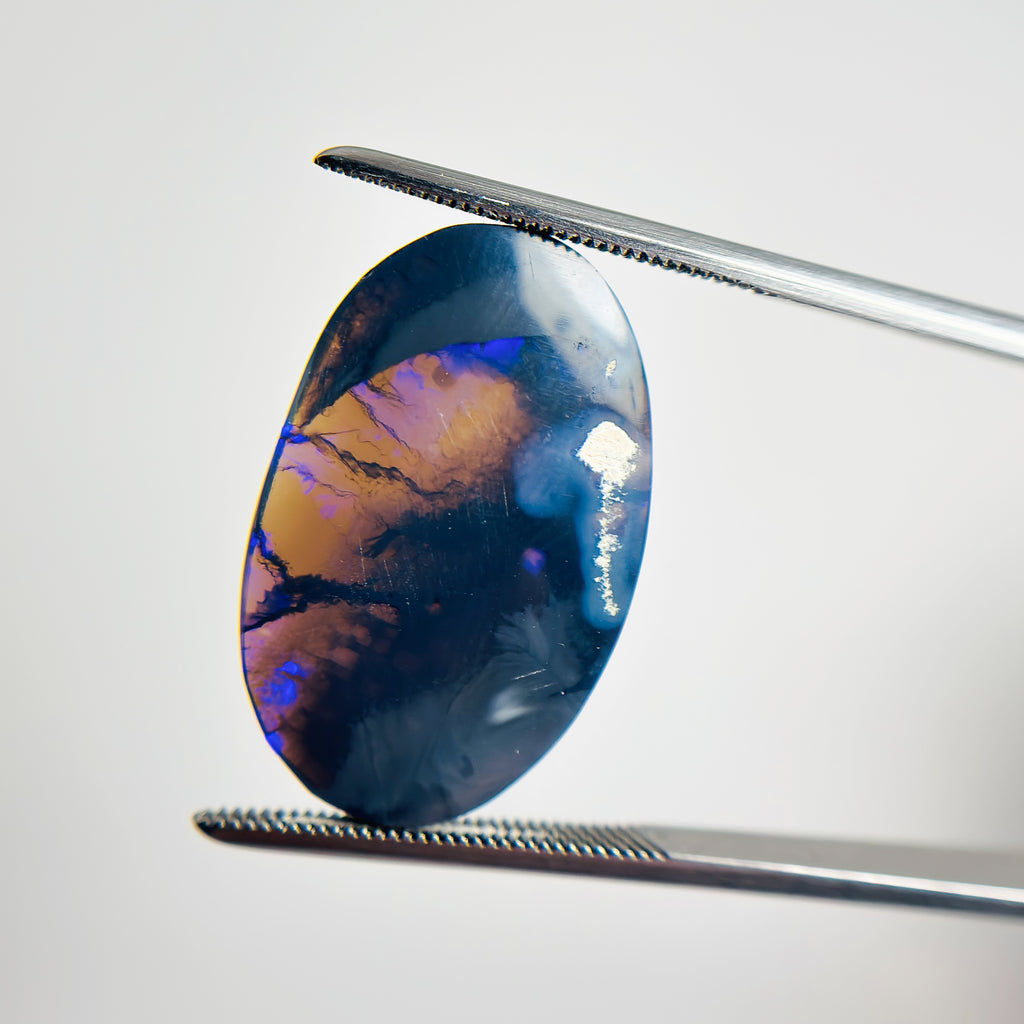 Black Opal Blue 24x16x3 Cabochon Oval 7.75 Carat