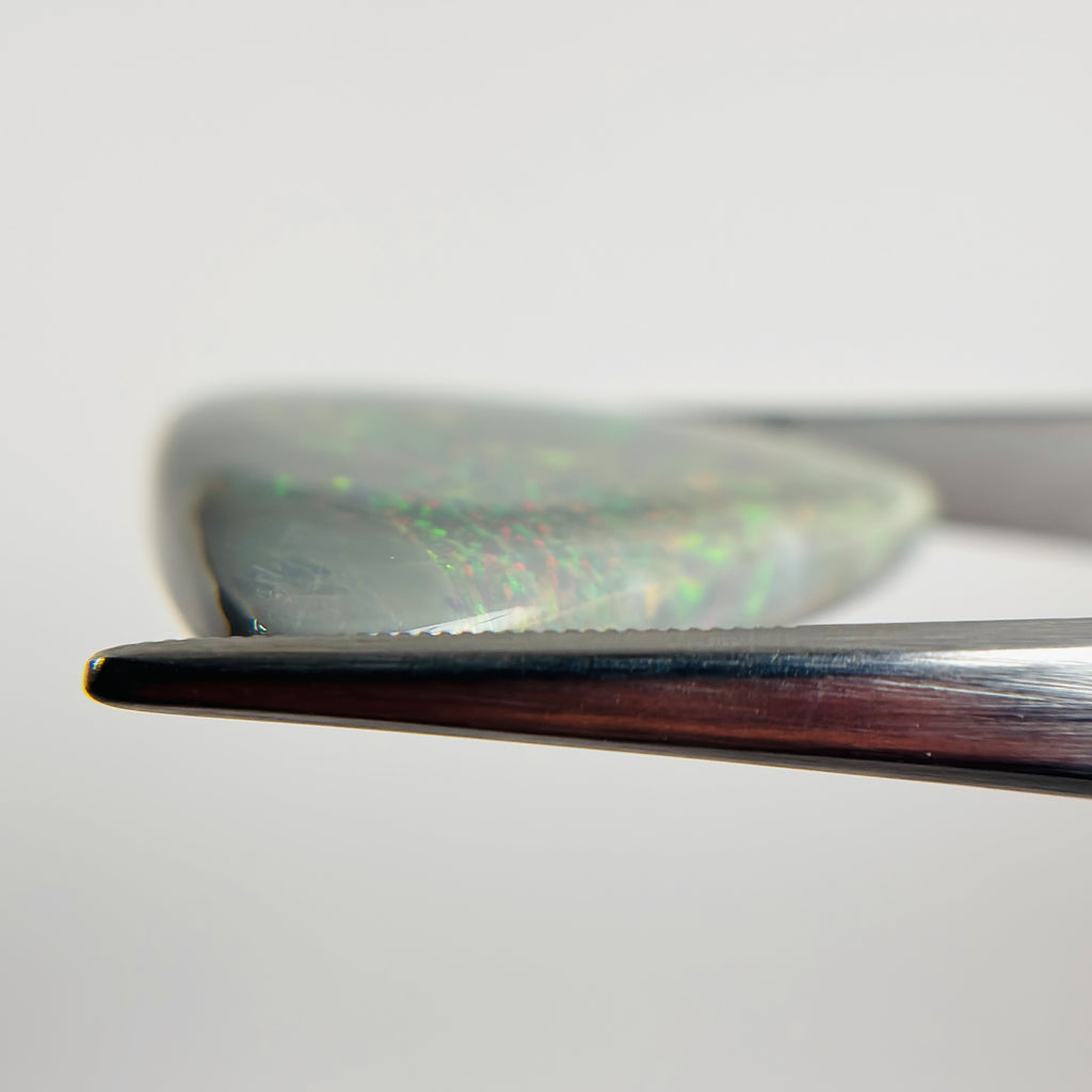 Semi Black Opal Red Multicolour 27x30x5.5 Cabochon Triangle 25.30 Carat