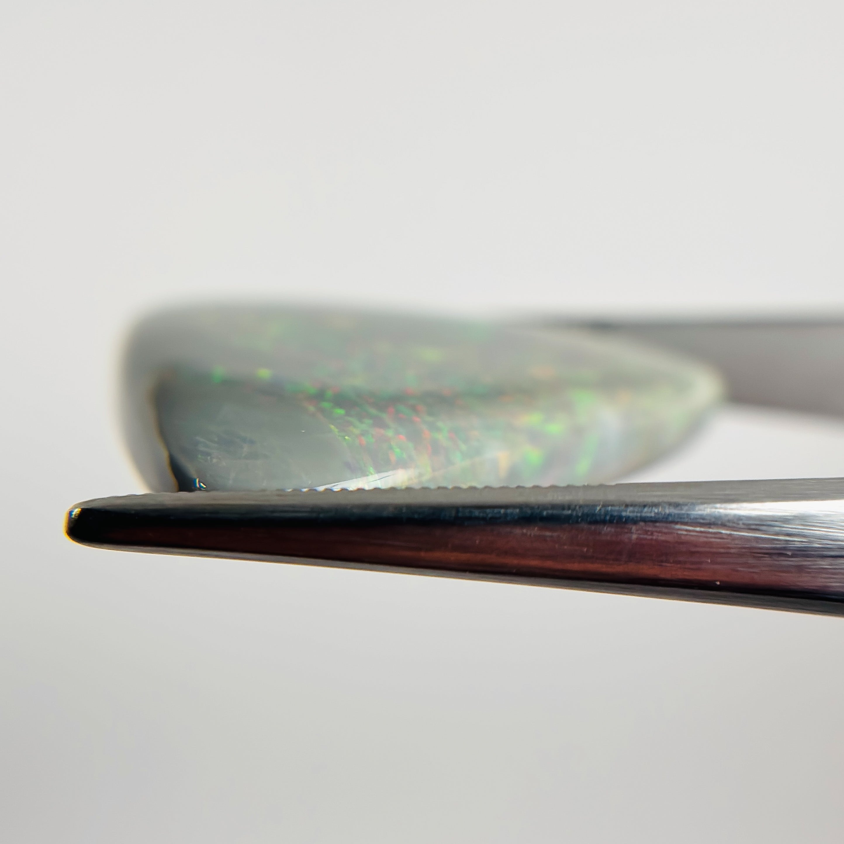 Semi Black Opal Red Multicolour 27x30x5.5 Cabochon Triangle 25.30 Carat