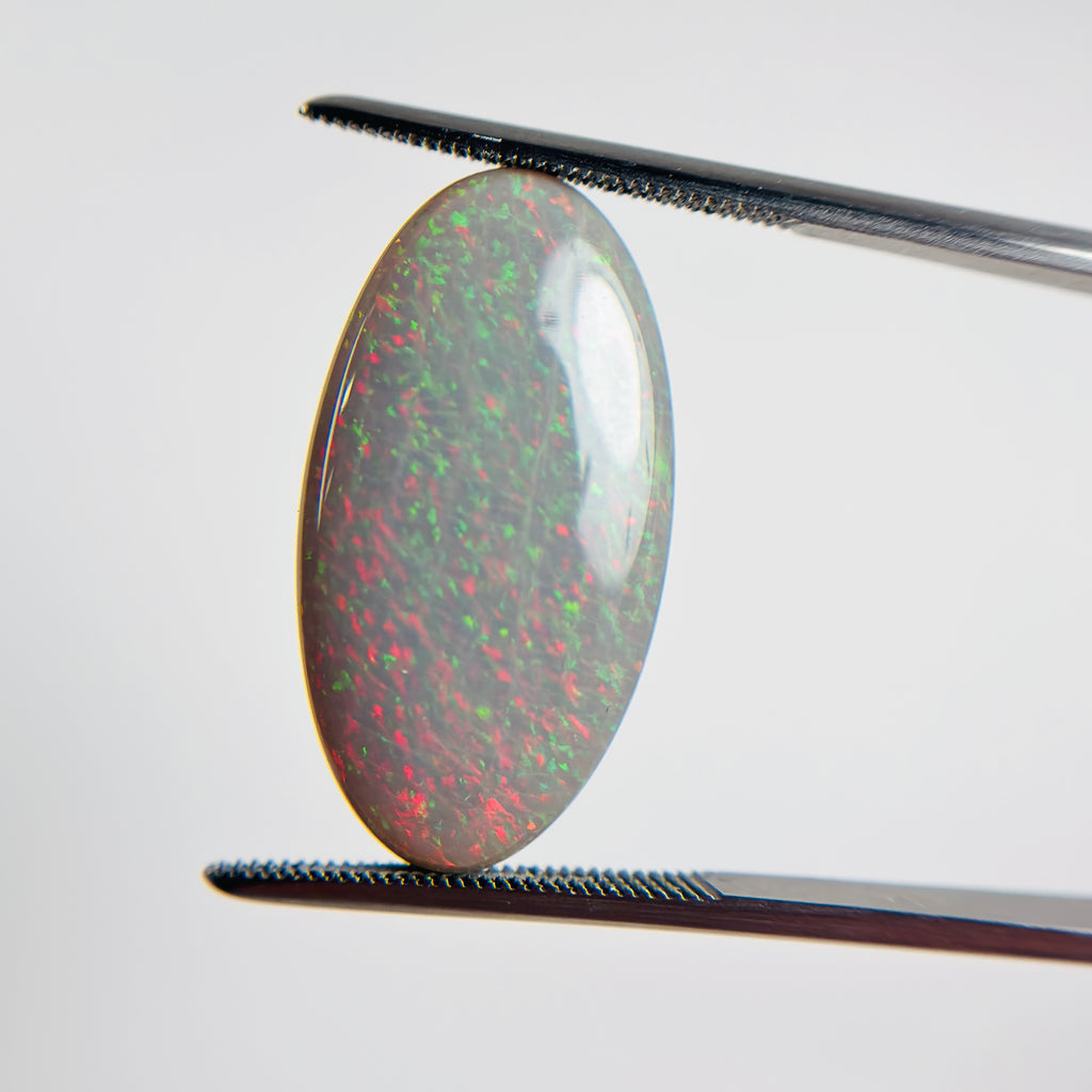 Semi Black Opal Red Multicolour 25x13.5x4.7 Cabochon Marquise 10.65 Carat