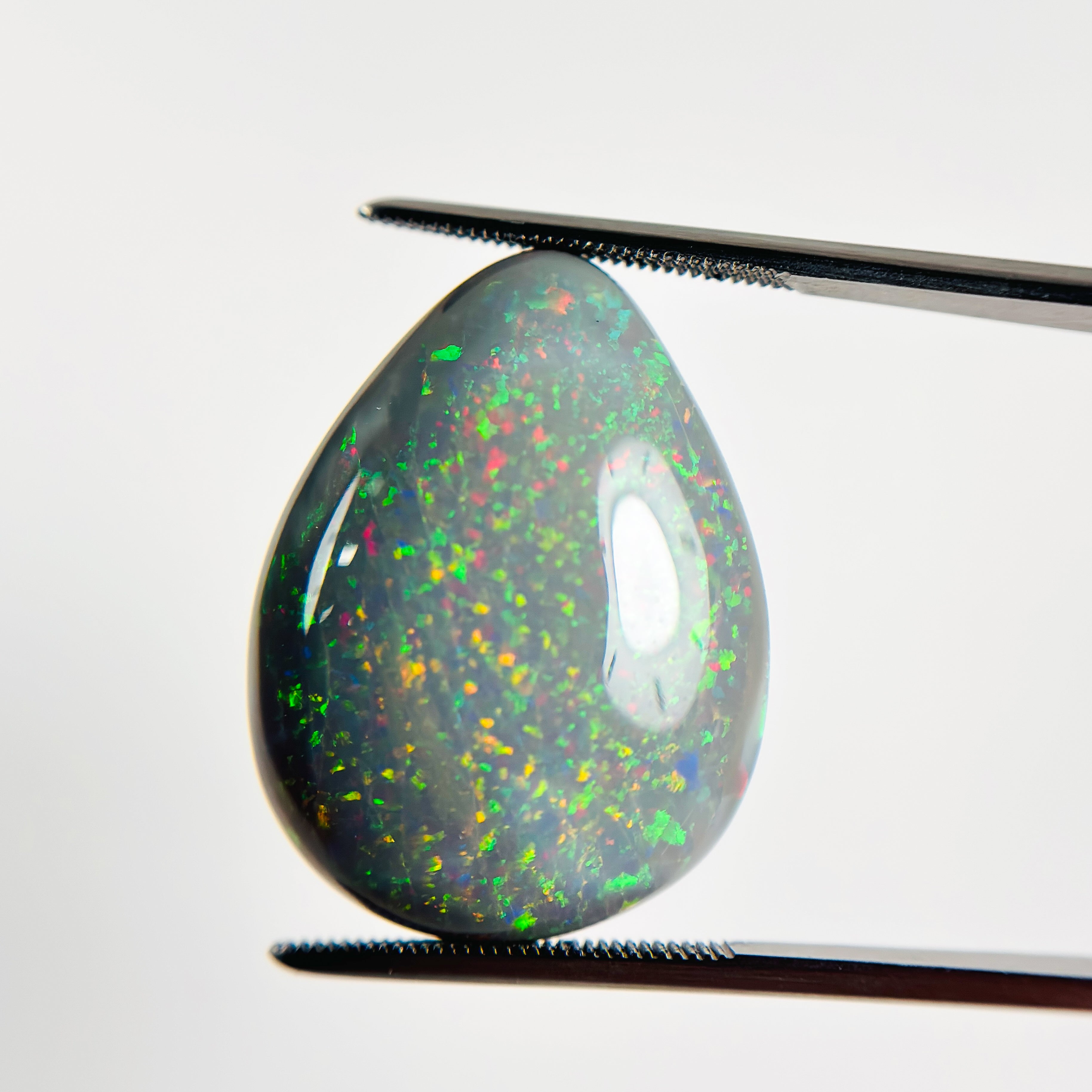 Semi Black Opal Red Green 28x21x7.2 Cabochon Pear 23.80 Carat