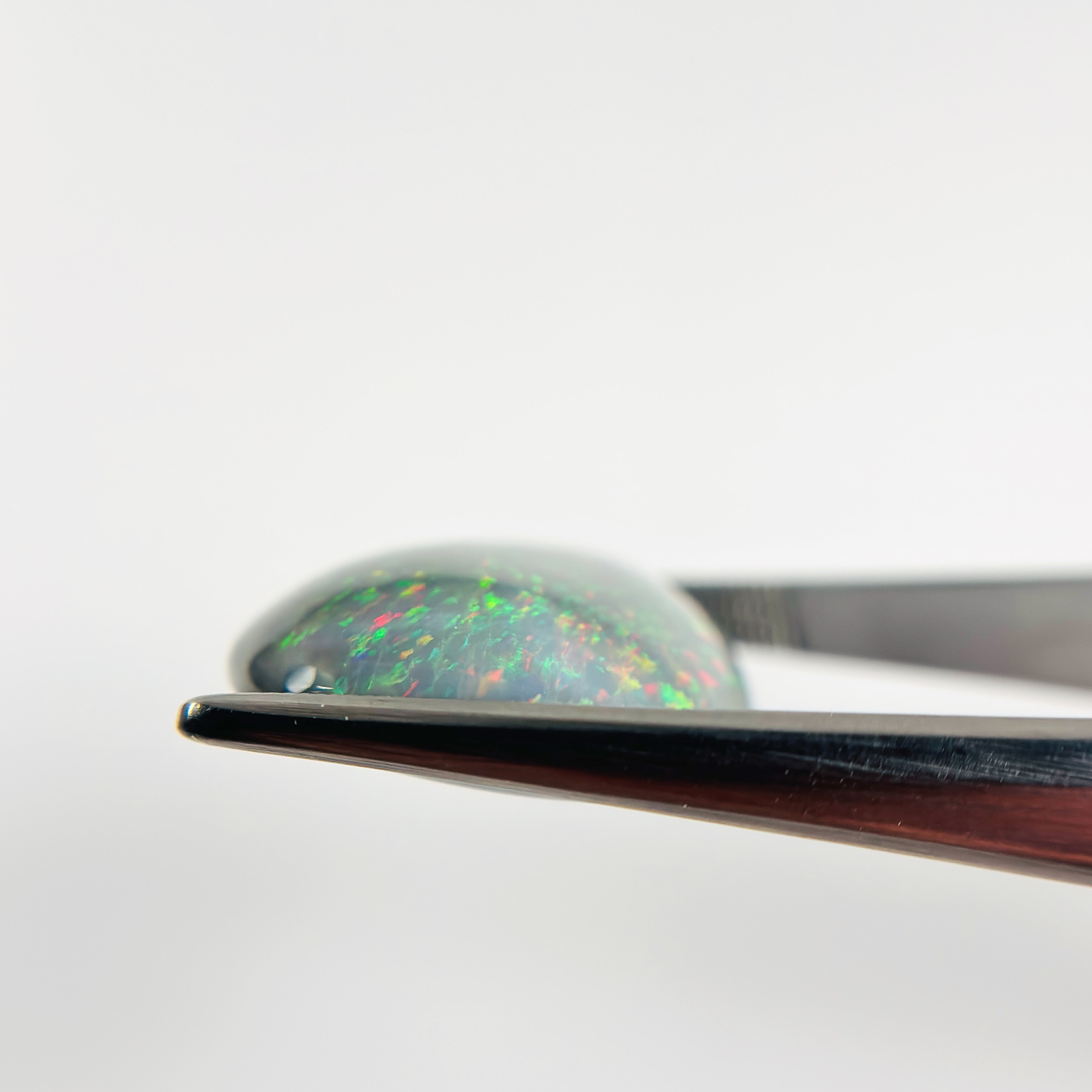 Semi Black Opal Red Green 28x21x7.2 Cabochon Pear 23.80 Carat