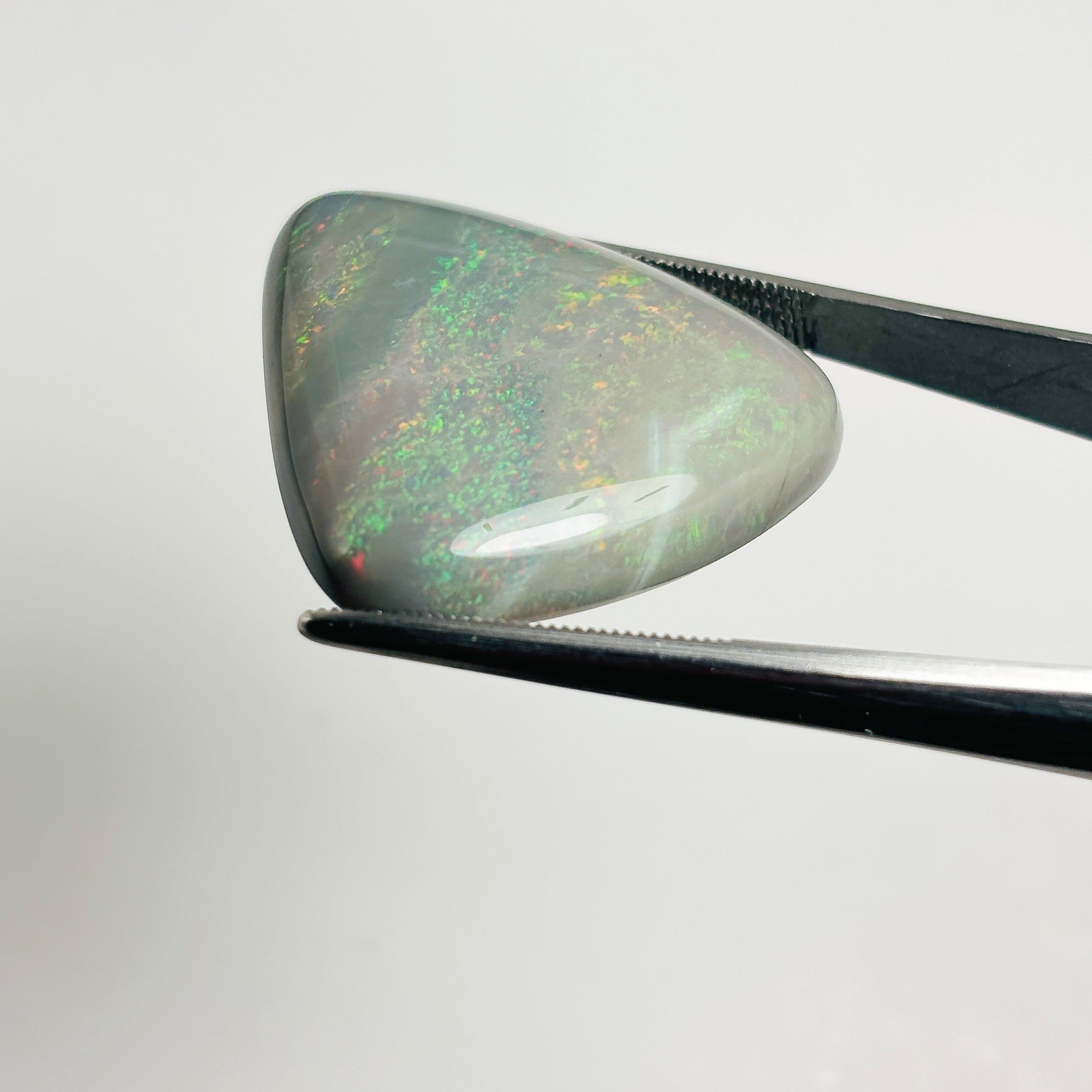 Semi Black Opal Red Multicolour 30x28x6.7 Cabochon Triangle 33.85 Carat