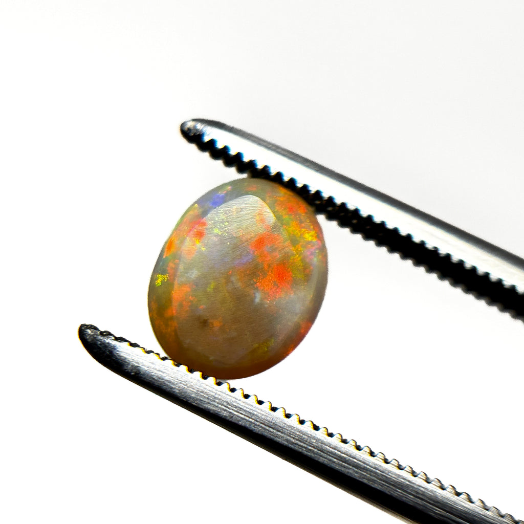 Crystal Opal Red Multicolour 8x6x4 Cabochon Oval 1.25 Carat