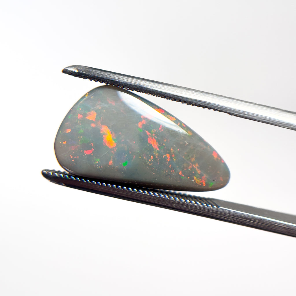 Semi Black Opal Red Multicolour 10x6.5x3.3 Cabochon Freeform 4.1 Carat