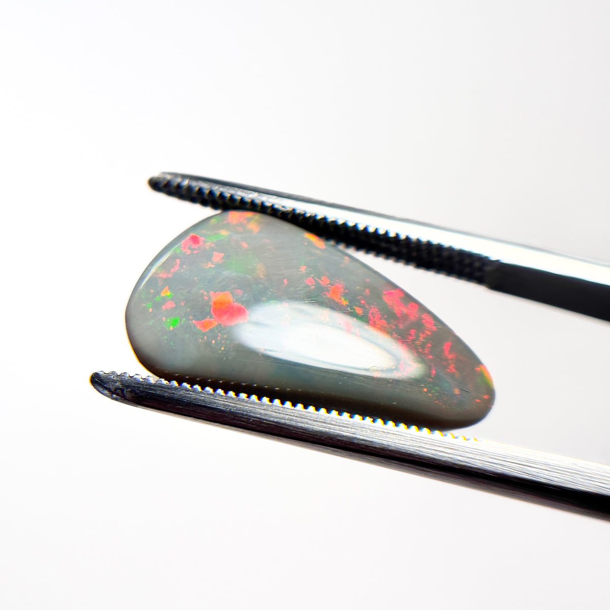 Semi Black Opal Red Multicolour 10x6.5x3.3 Cabochon Freeform 4.1 Carat